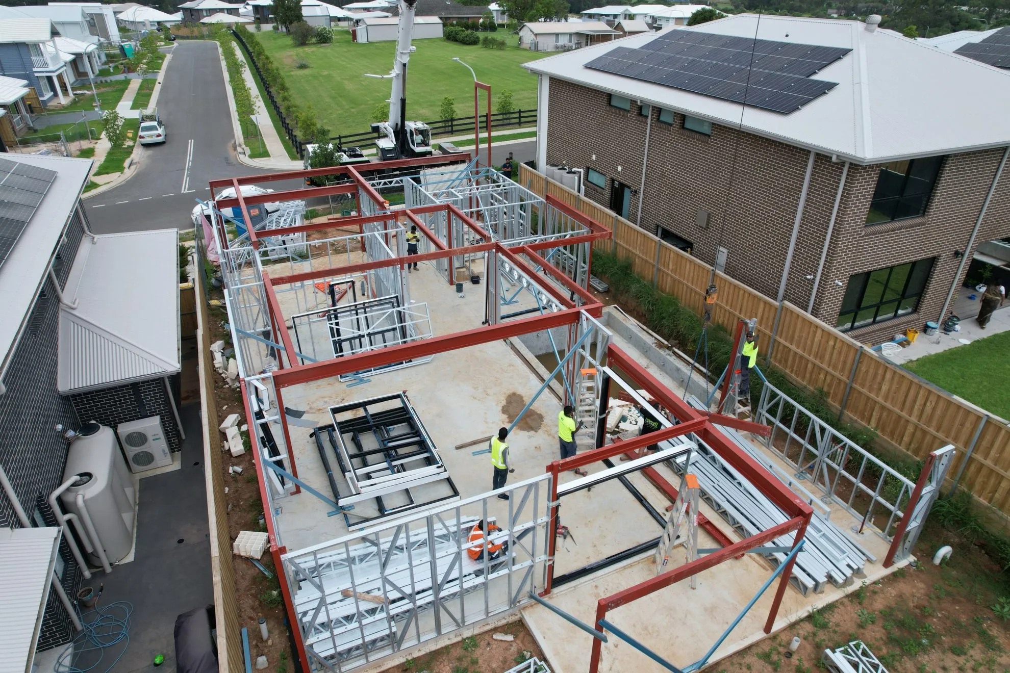 AAA project: Aerial view of workers assembling a steel framework